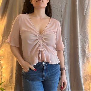 Pink blouse with adjustable tie at front